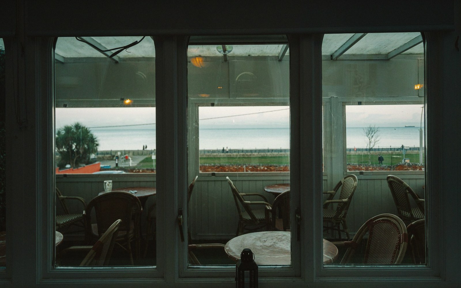 An empty pub interior on a weekday afternoon, chairs on tables