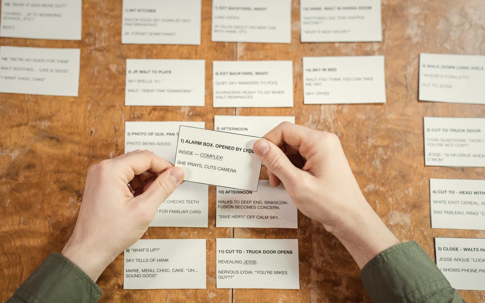 Index cards spread on a desk, handwritten facts